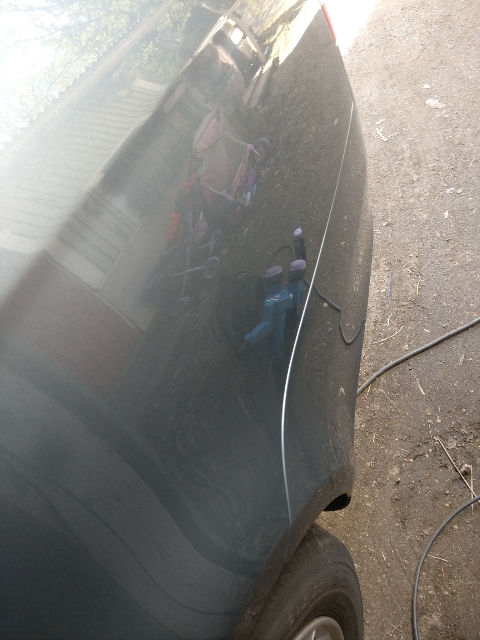 Kuvassa lymyilee laitos jolla tuo auto tuli käytyä läpi